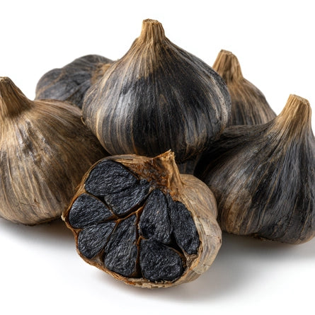 Black garlic bulbs on a white background